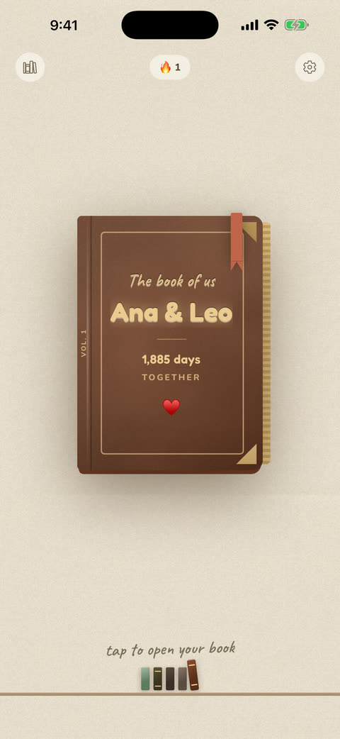 The WallUs home screen: a cognac leather book stamped in gold foil, titled “Ana & Leo”, with a day count.
